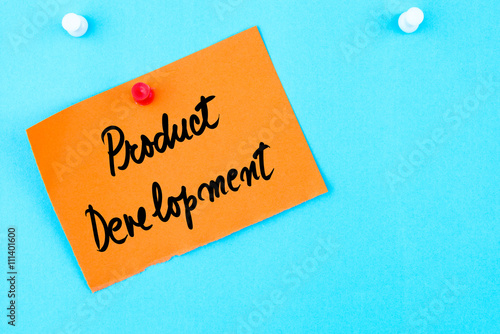 Product Development written on orange paper note