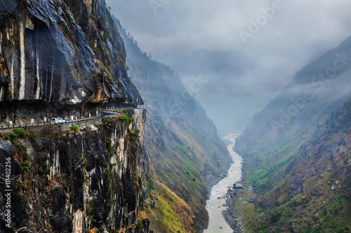 Car on road in Himalayas photo