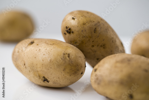 Potato isolated on white background close up