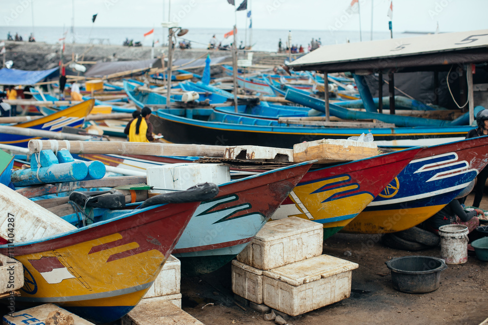Colorful fishing boats anchored at a Beach in Bali Island, Indon