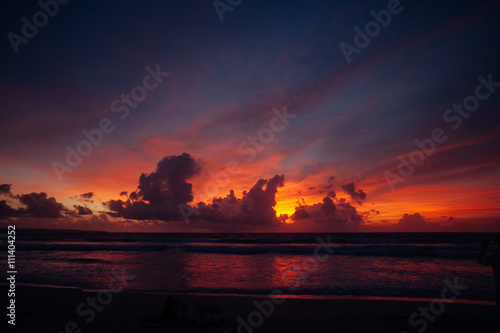 Calm peaceful ocean and beach on tropical sunrise. Bali, Indones