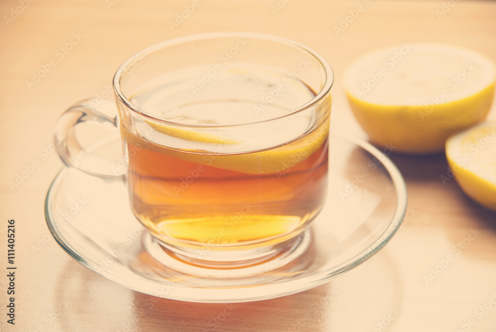 Hot lemon tea on table with soft light morning.