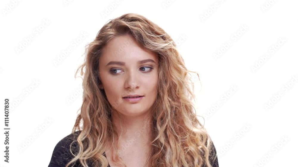 Pretty curly blondie woman watching at the different sides. Close up. Slow motion Pretty curly blondie woman watching at the different sides. Close up. Slow motion
