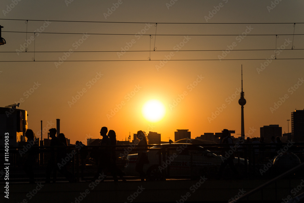 peoples silhouette at sunset in berlin