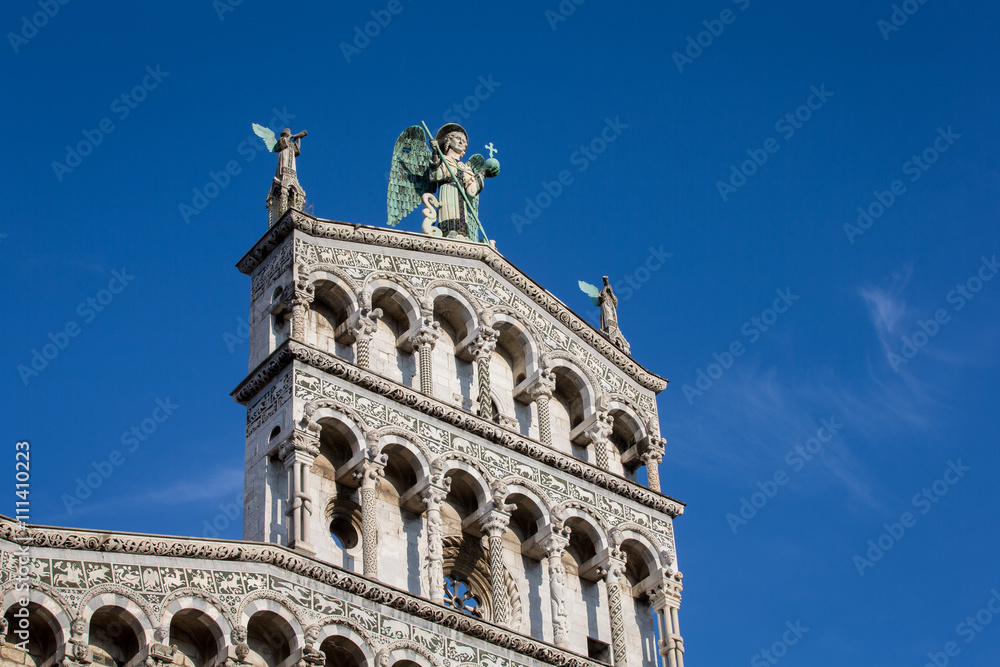 Blue Eyed Angel Atop an Ornate Church Facade
