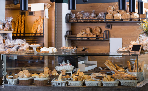 Display of ordinary bakery with bread and buns photo