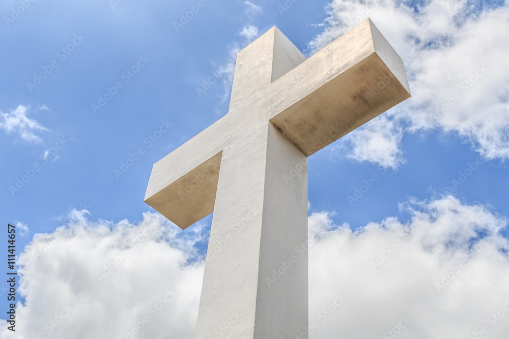 The historic Mt. Helix cross with a cloudy blue sky in La Mesa, a city in San Diego, California.  