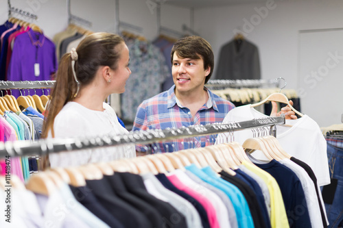 pair chooses clothes at the store