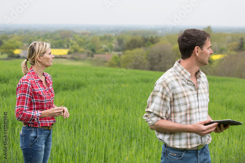 female farmer teaching young farmer about culture barley 