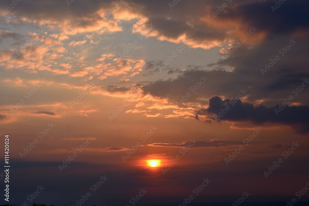 Beautiful sunset - sunrise with clouds. Sky with clouds. Colorful natural background.