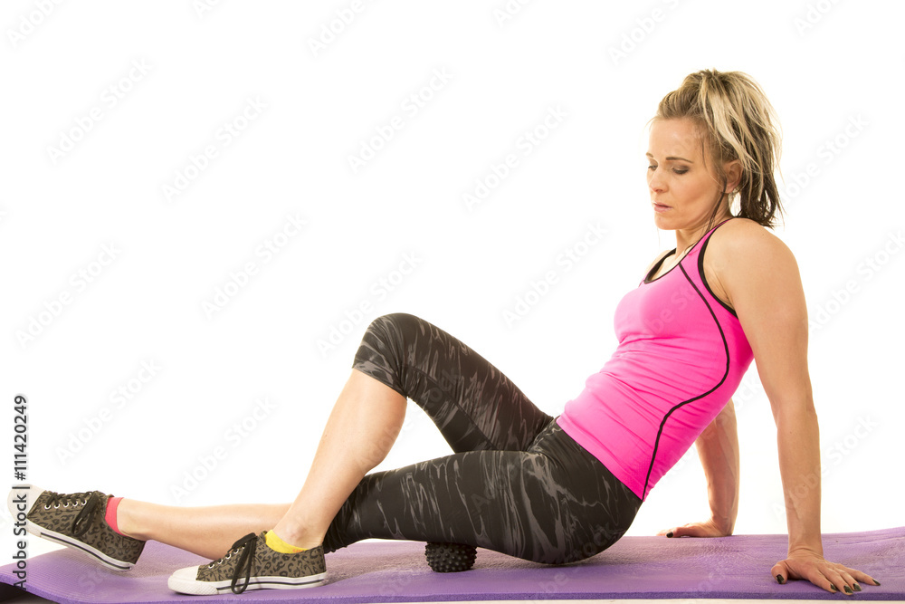 fit woman rolling out her thigh fit woman rolling out her thigh