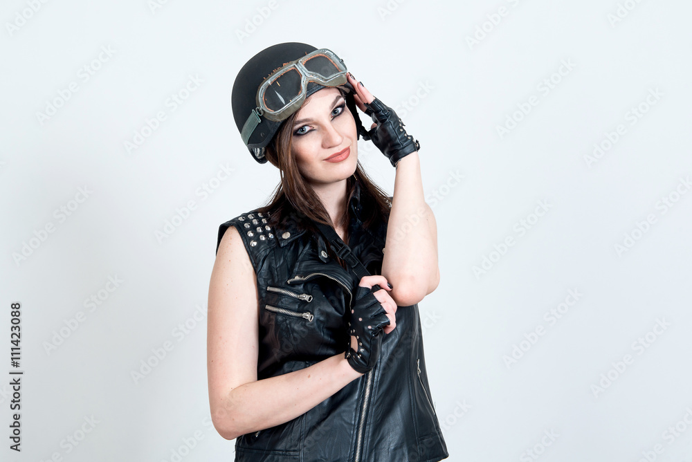 Fashion portrait of sexy stunning hipster woman, bright make up, vintage sunglasses, biker leather jacket, trendy jewelry and accessorizes. Urban wall background. Photoshoot relaxed biker Fashion portrait of sexy stunning hipster woman, bright make up, vintage sunglasses, biker leather jacket, trendy jewelry and accessorizes. Urban wall background. Photoshoot relaxed biker