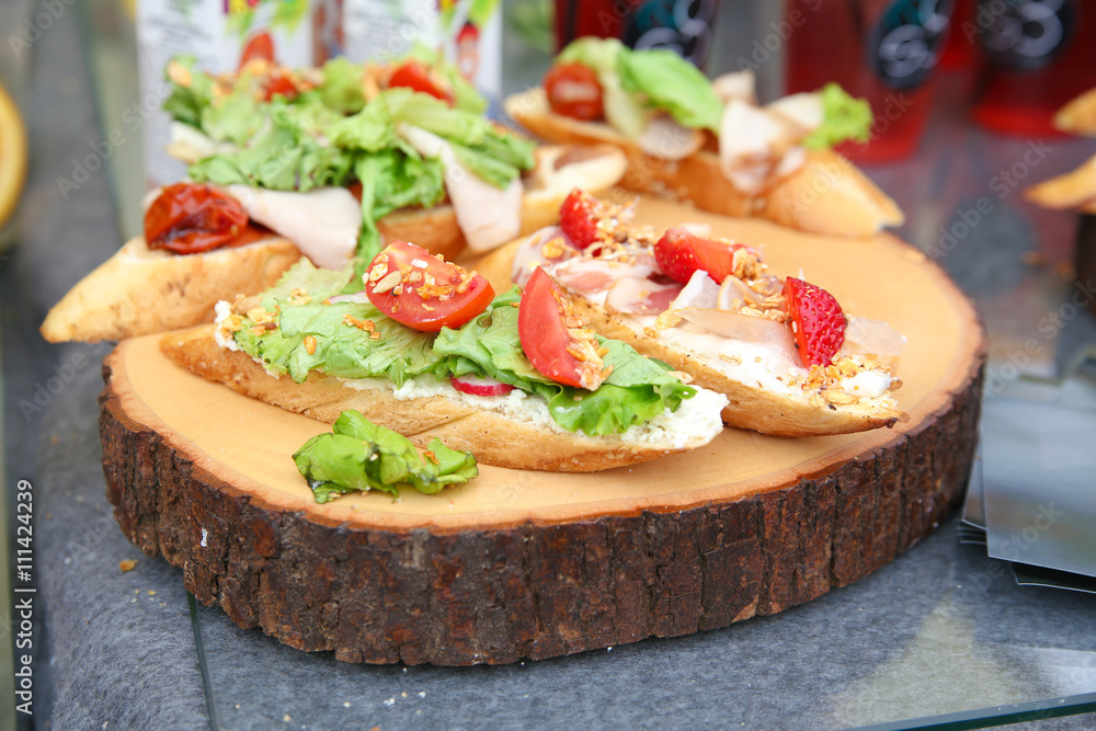 Sandwiches on wooden background