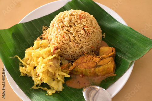 Malaysian Nasi Kandar on banana leaf, Georgetown, Penang, Malaysia photo