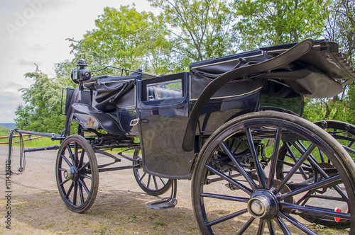 Black carriage for horse riding.