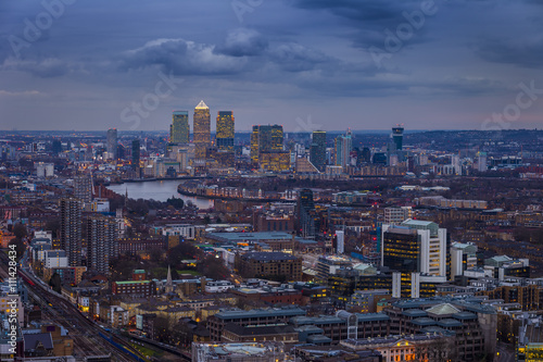 London, England - Panoramic skyline view of London and leading business district Canary Wharf at blue hour