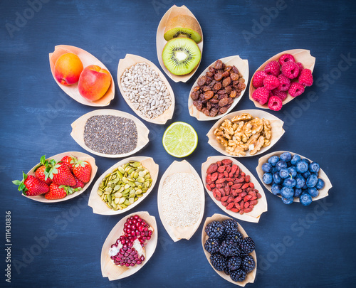 Berries, fruits, nuts, seeds top view.Healthy, detox, super food concept.