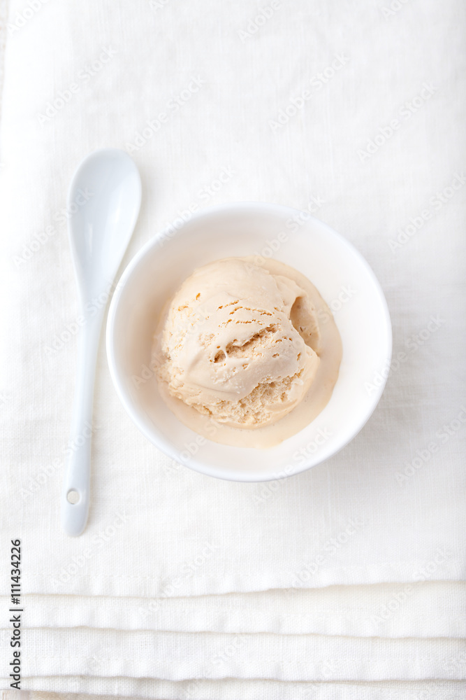 Ice cream with Earl grey tea flavor in white bowl Ice cream with Earl grey tea flavor in white bowl