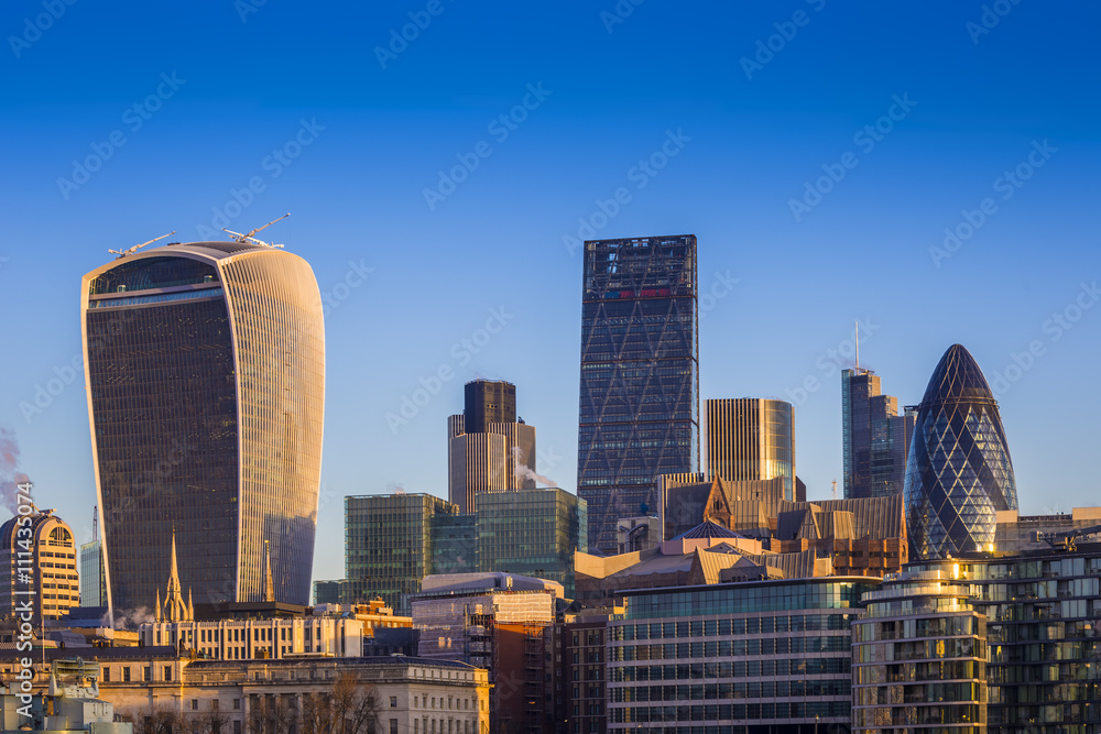 Naklejka premium London, England - Bank. The world famous business district of London with skyscrapers and clear blue sky 