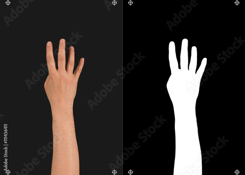 Hand on a black background and a mask for cutting