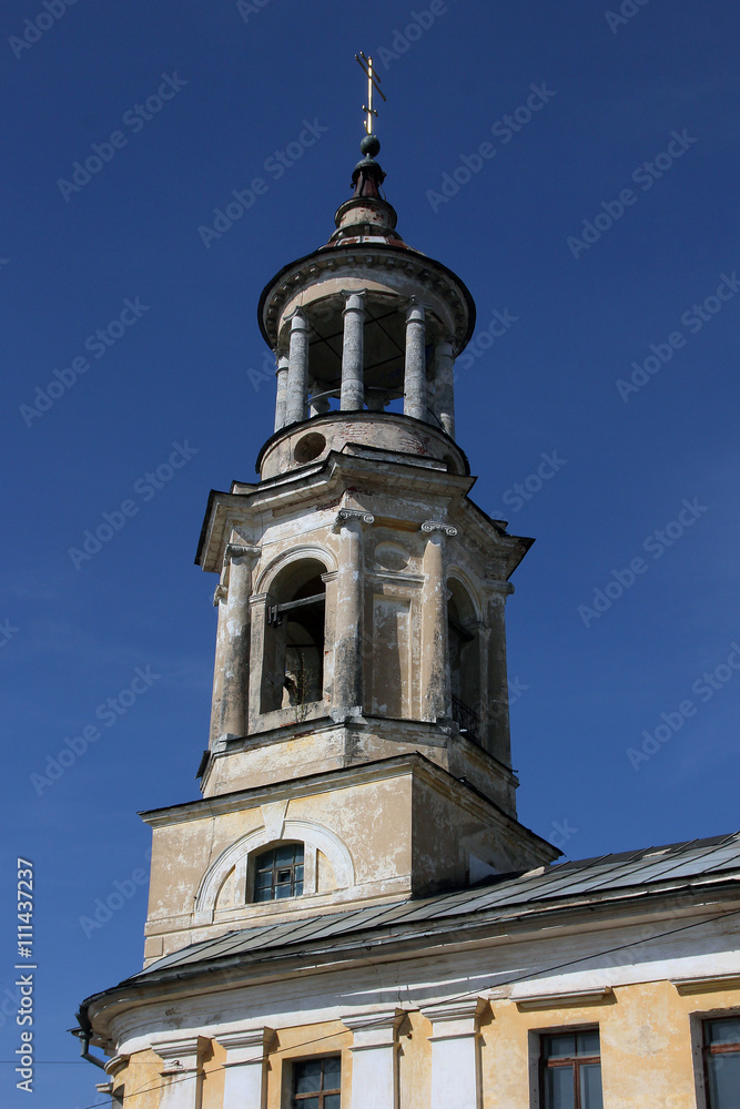 Old abandoned bell tower of orthodox church in the classical sty