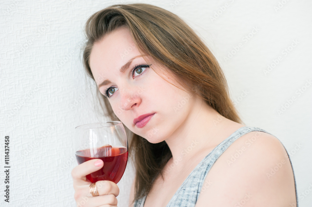 beautiful girl with a glass of wine at home beautiful girl with a glass of wine at home