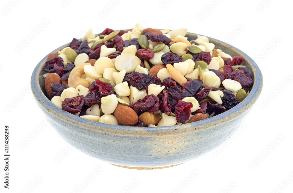 Nuts and fruit trail mix in a bowl isolated on a white background Nuts and fruit trail mix in a bowl isolated on a white background