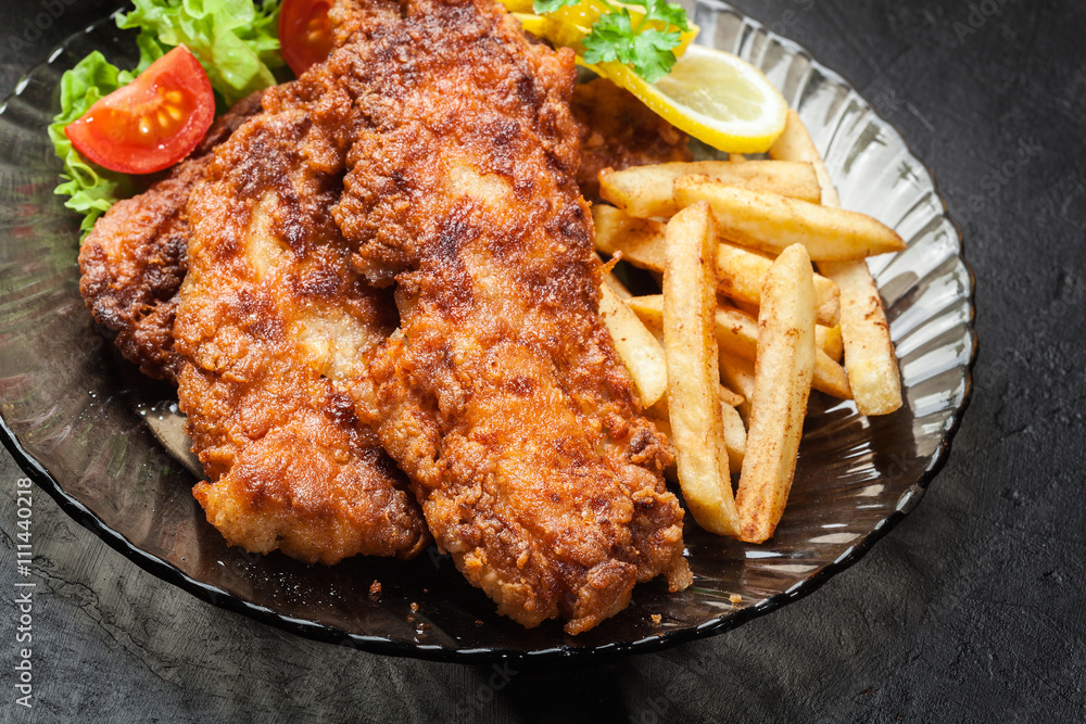 Fried fish in crispy batter with chips