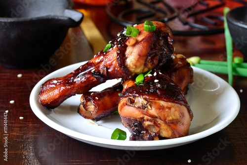 Grilled chicken legs with sesame seeds, soy sauce, green onions