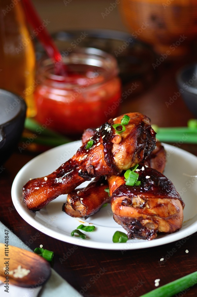 Grilled chicken legs with sesame seeds, soy sauce, green onions