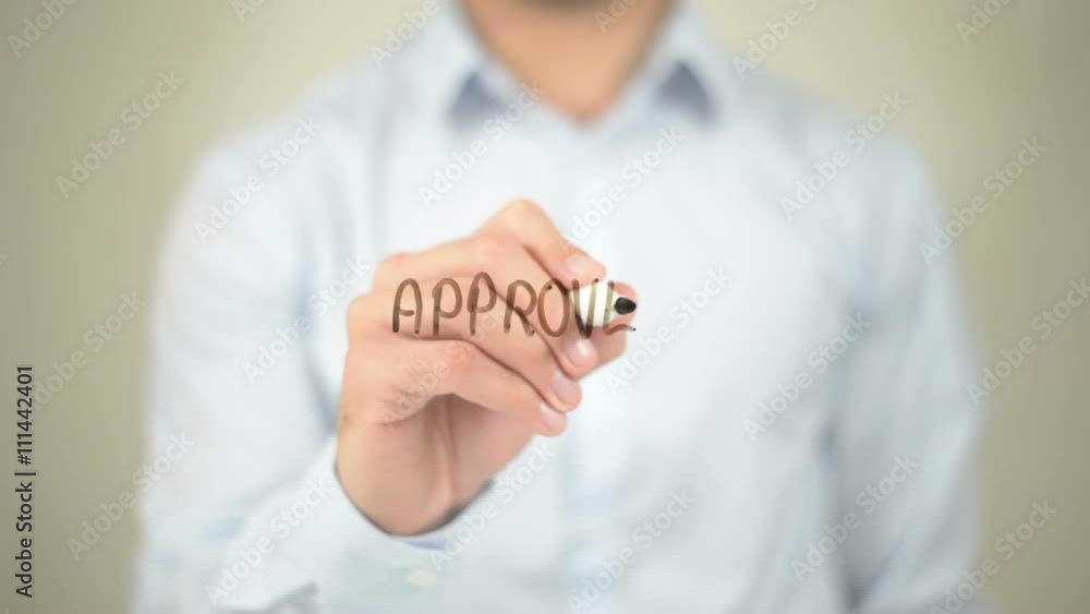 Approved, Man writing on transparent screen Approved, Man writing on transparent screen
