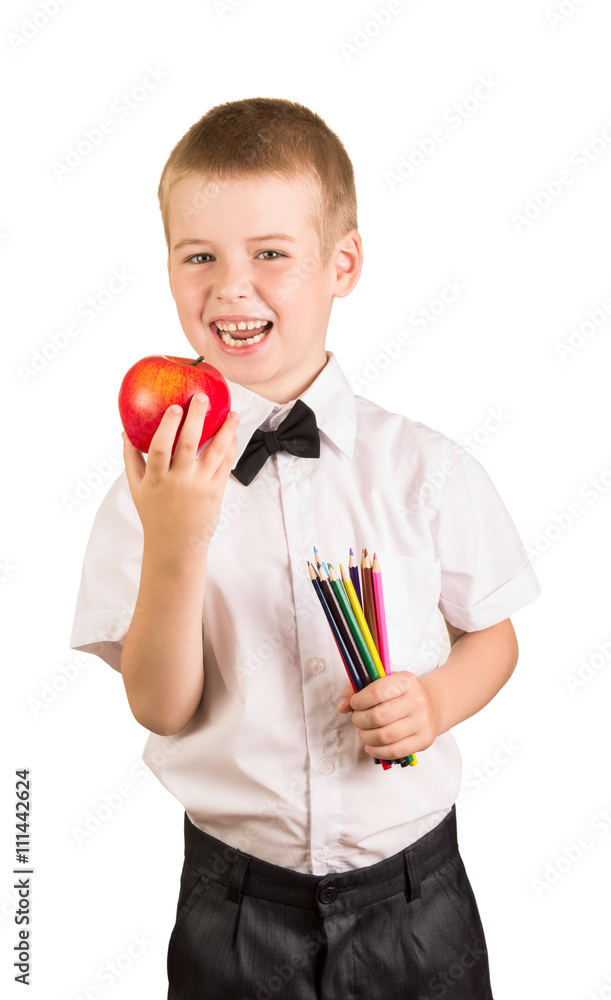 Happy schoolboy holding pencil and apple isolated on white background. Happy schoolboy holding pencil and apple isolated on white background.
