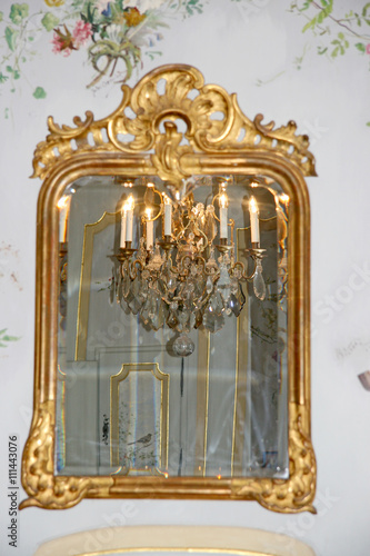 Mirror / Antique mirror with a reflection of chandelier