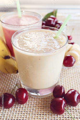 Cherry and banana and milk smoothie. Milkshake with cherries and bananas. 