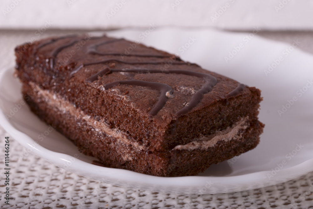 the cake lays on a white plate the cake lays on a white plate