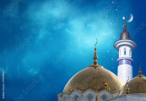 Ramadan Kareem background.Crescent moon at a top of a mosque