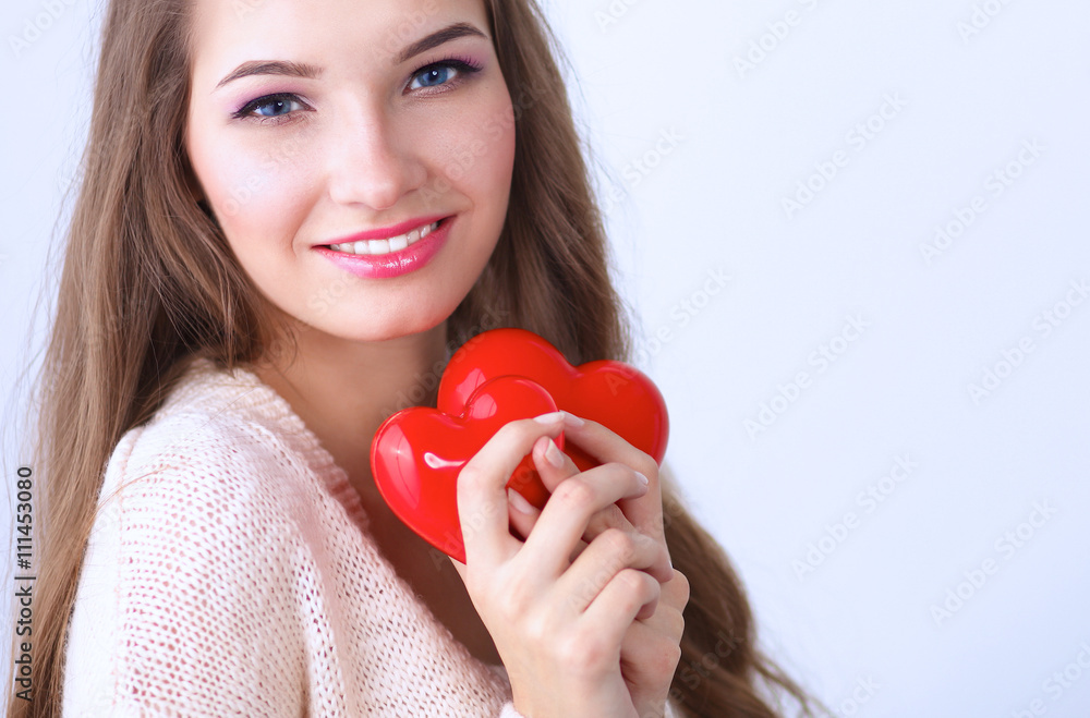 Portrait of beautiful happy woman holding a symbol heart. Portrait of beautiful happy woman holding a symbol heart.