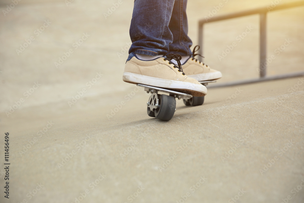freeline skateboarder legs riding on freeline at skatepark freeline skateboarder legs riding on freeline at skatepark