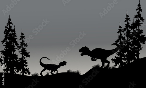 Silhouette of two allosaurus in hills