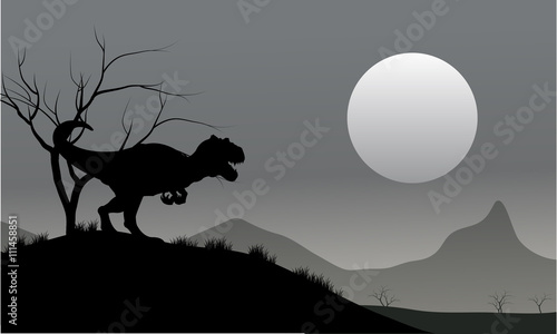 Silhouette of allosaurus with moon