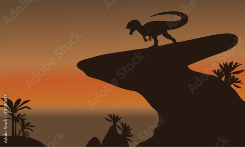 Silhouette of one allosaurus in cliff