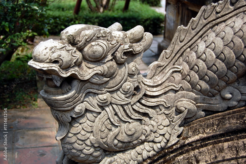 Naklejka premium Sculpture of guarding dragon in buddist temple