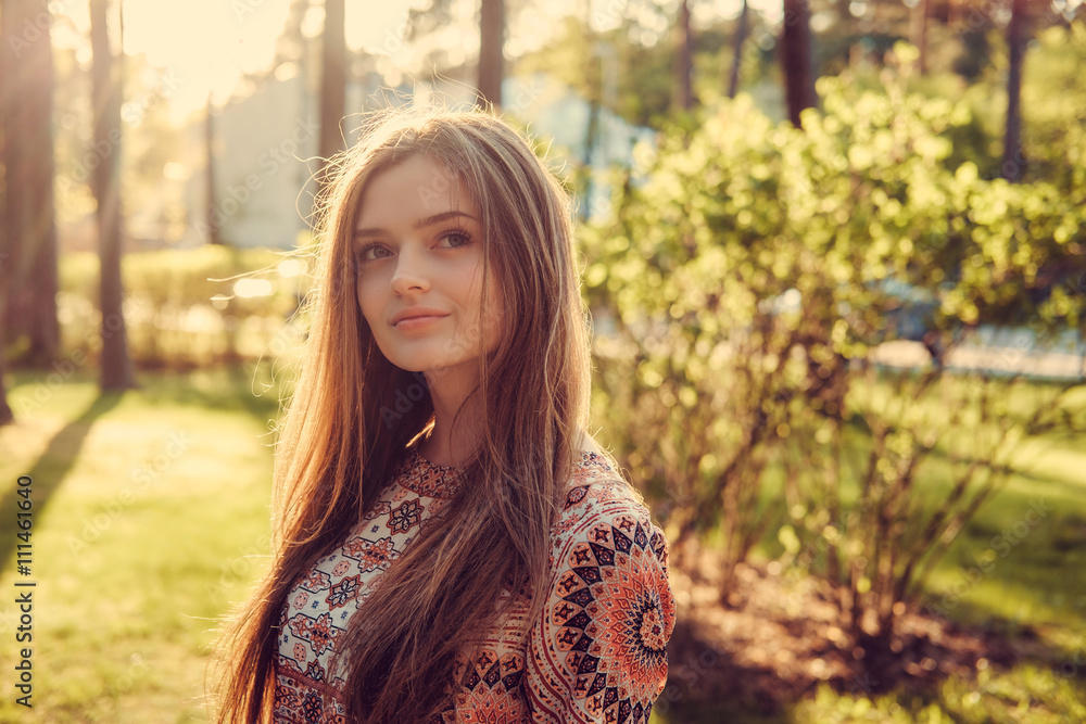 Portrait of long hair female in a park. Portrait of long hair female in a park.