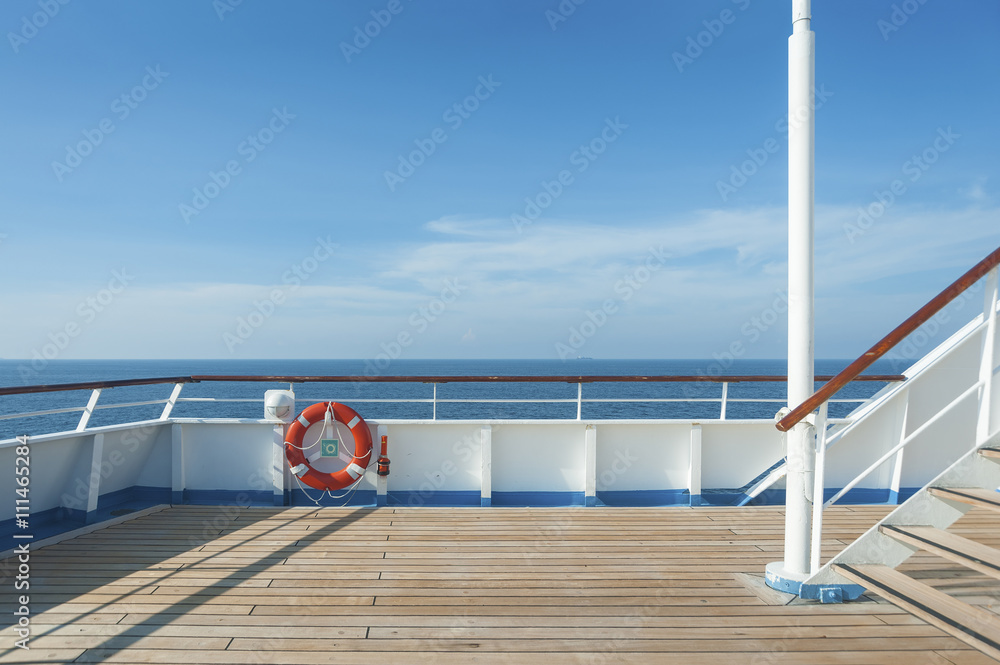 Ship deck, buoy and blue ocean. Travel background