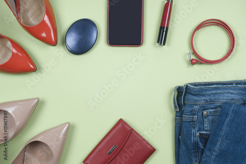Women clothing set and accessories on light background.Top view, different shoes on light background. Copy space for text.