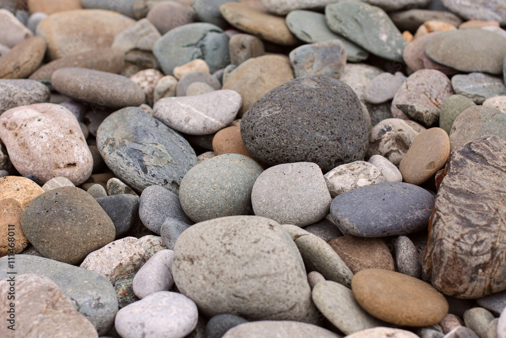Background of colorful beach pebbles of different shape and size
Background of colorful beach pebbles of different shape and size