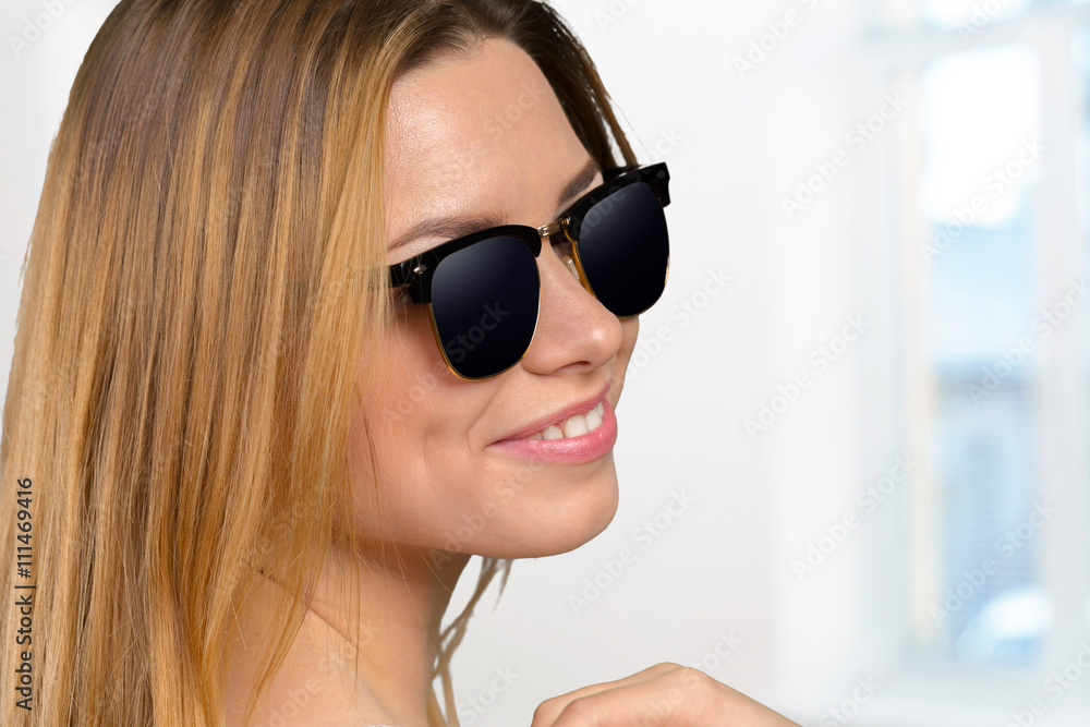 Head shot of woman wearing sunglasses Head shot of woman wearing sunglasses