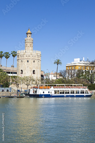 Torre del Oro, Seville, with tourist boat