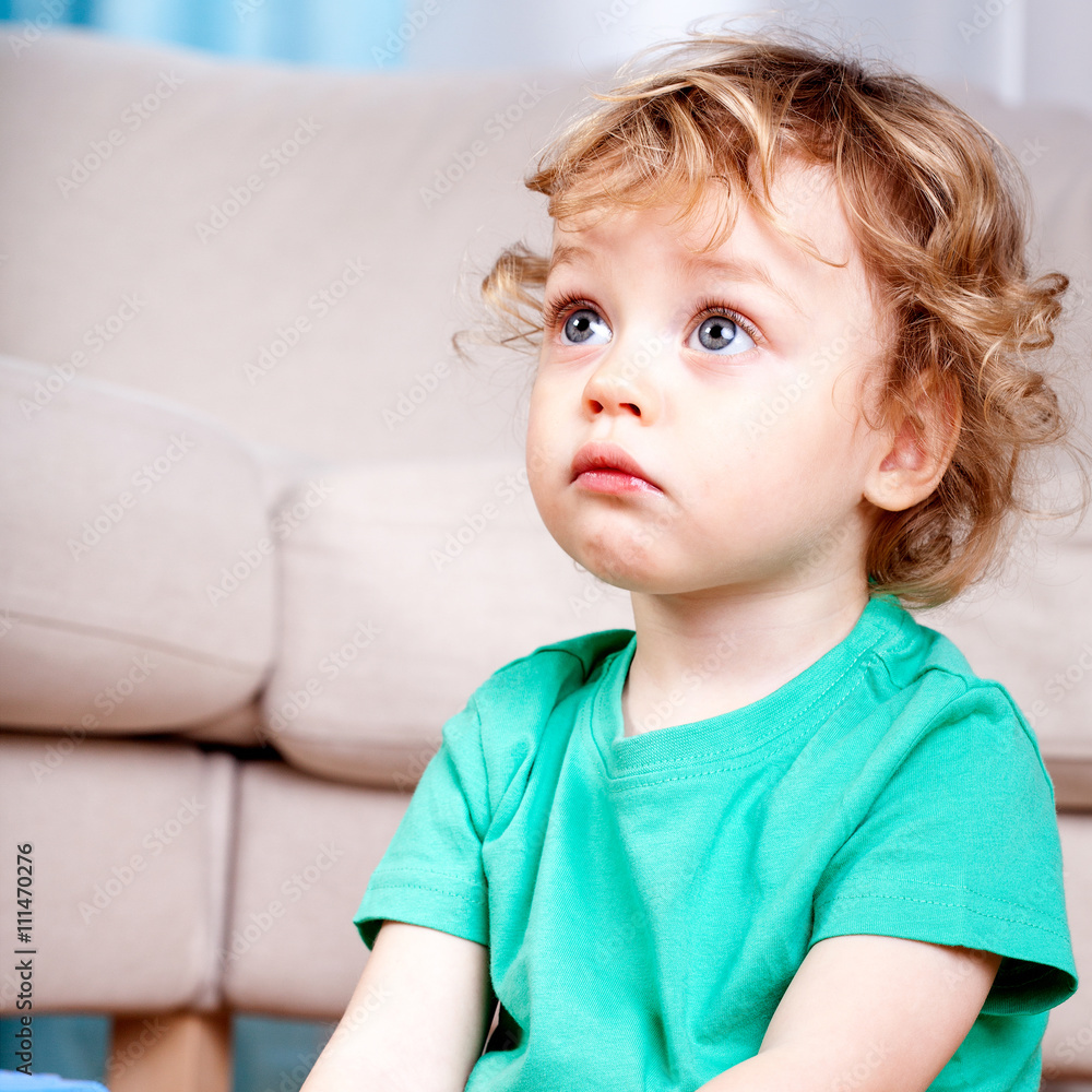 Sad little boy sitting Sad little boy sitting