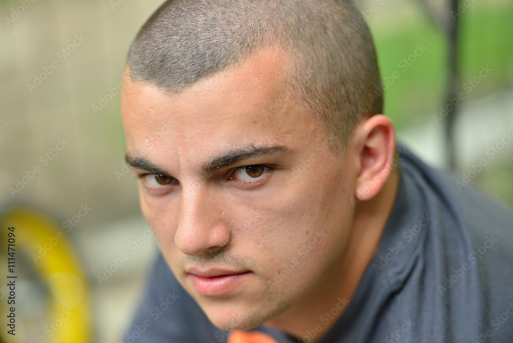 Portrait of serious and sad handsome young man outdoors in natur Portrait of serious and sad handsome young man outdoors in natur
